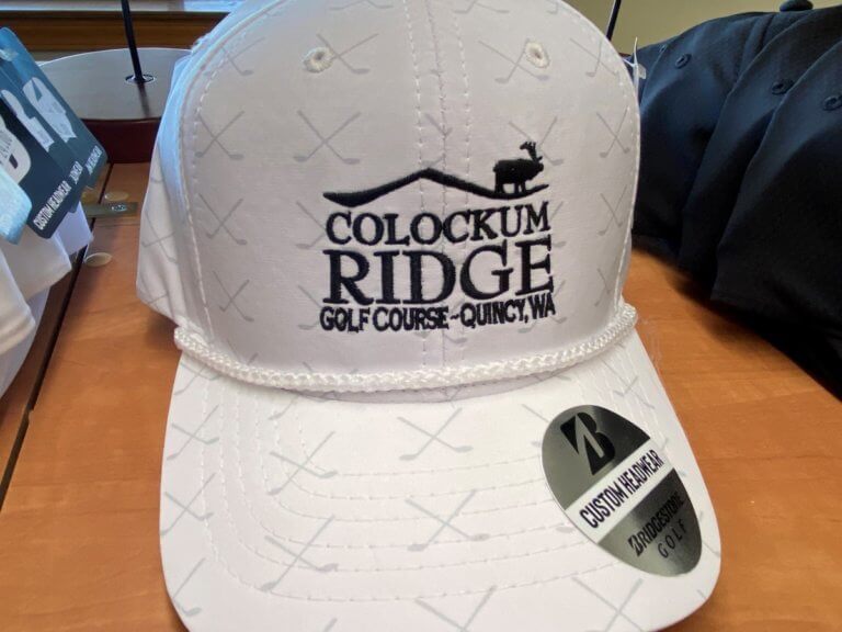 White Colockum Ridge golf hat with logo and crossed clubs