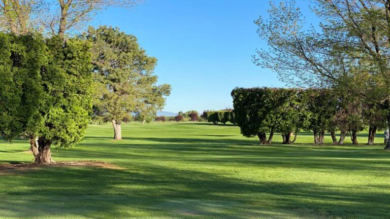 Wide fairway at Colockum Ridge Golf Course under a clear sky.