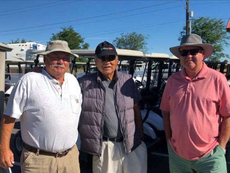 Two golfers smiling for the camera at Colockum Ridge Golf Course