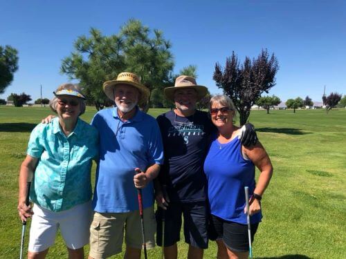 Group of golfers smiling together at Colockum Ridge Golf Course
